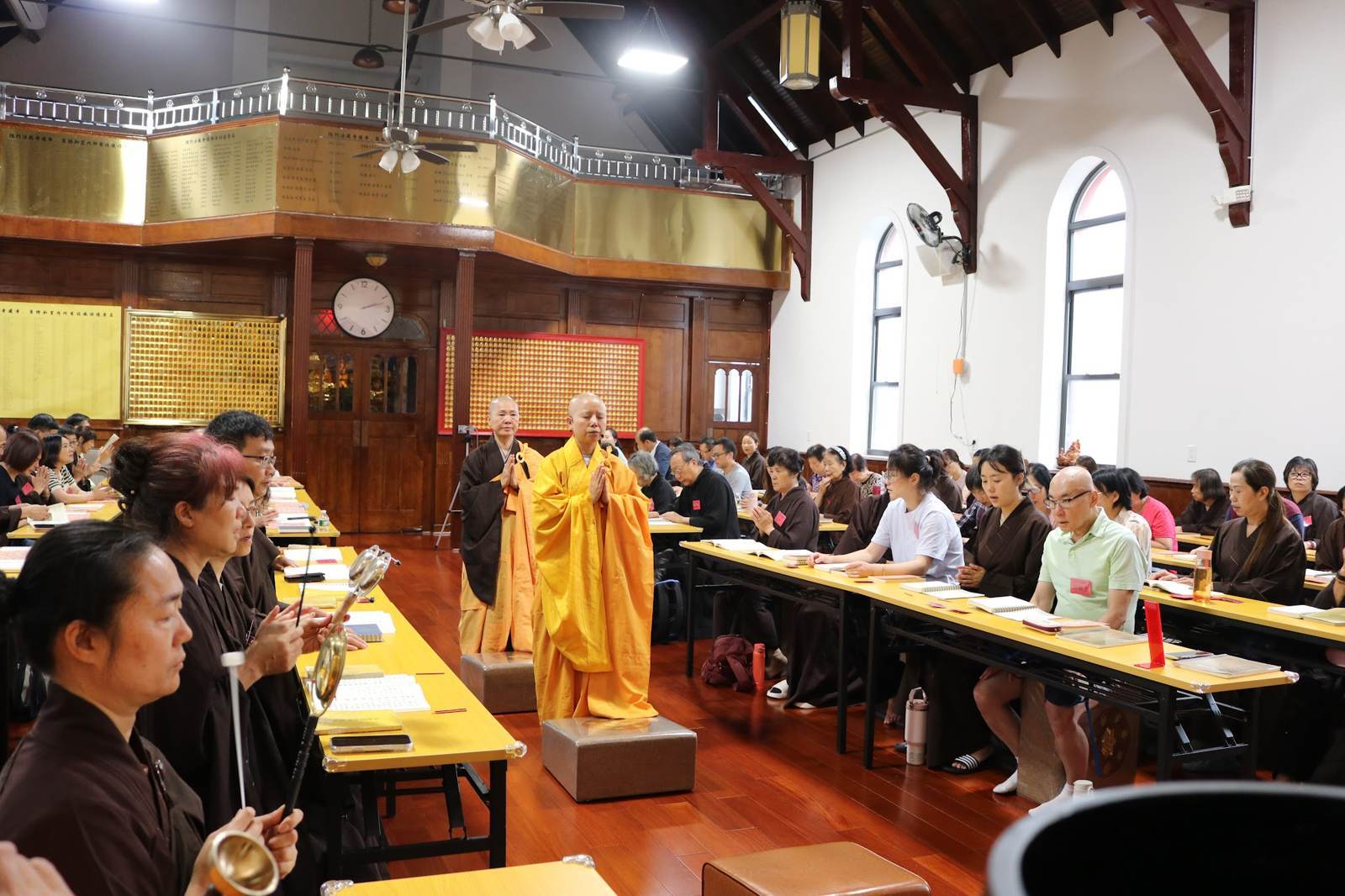 A monastic leading the assembly in chanting