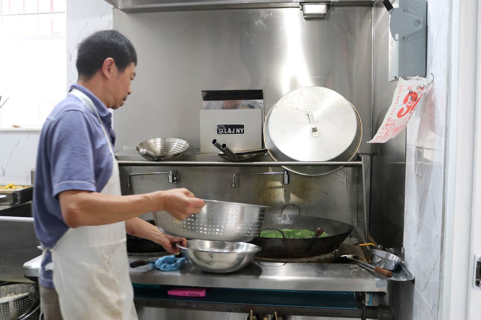 A volunteer cooking in the monastery kitchen
